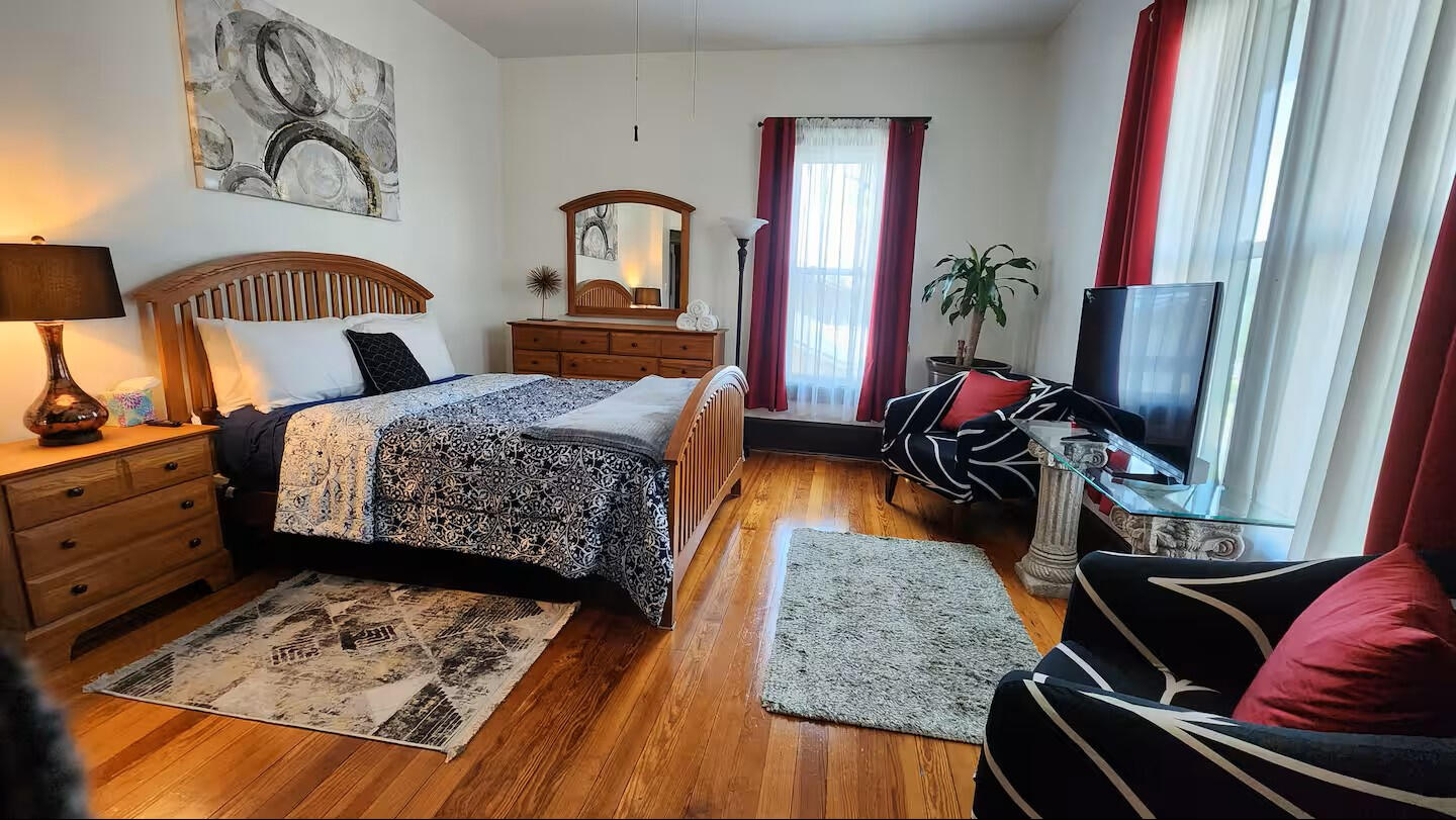 Guest Bedroom • Spacious Layout with TV &amp; Natural Light